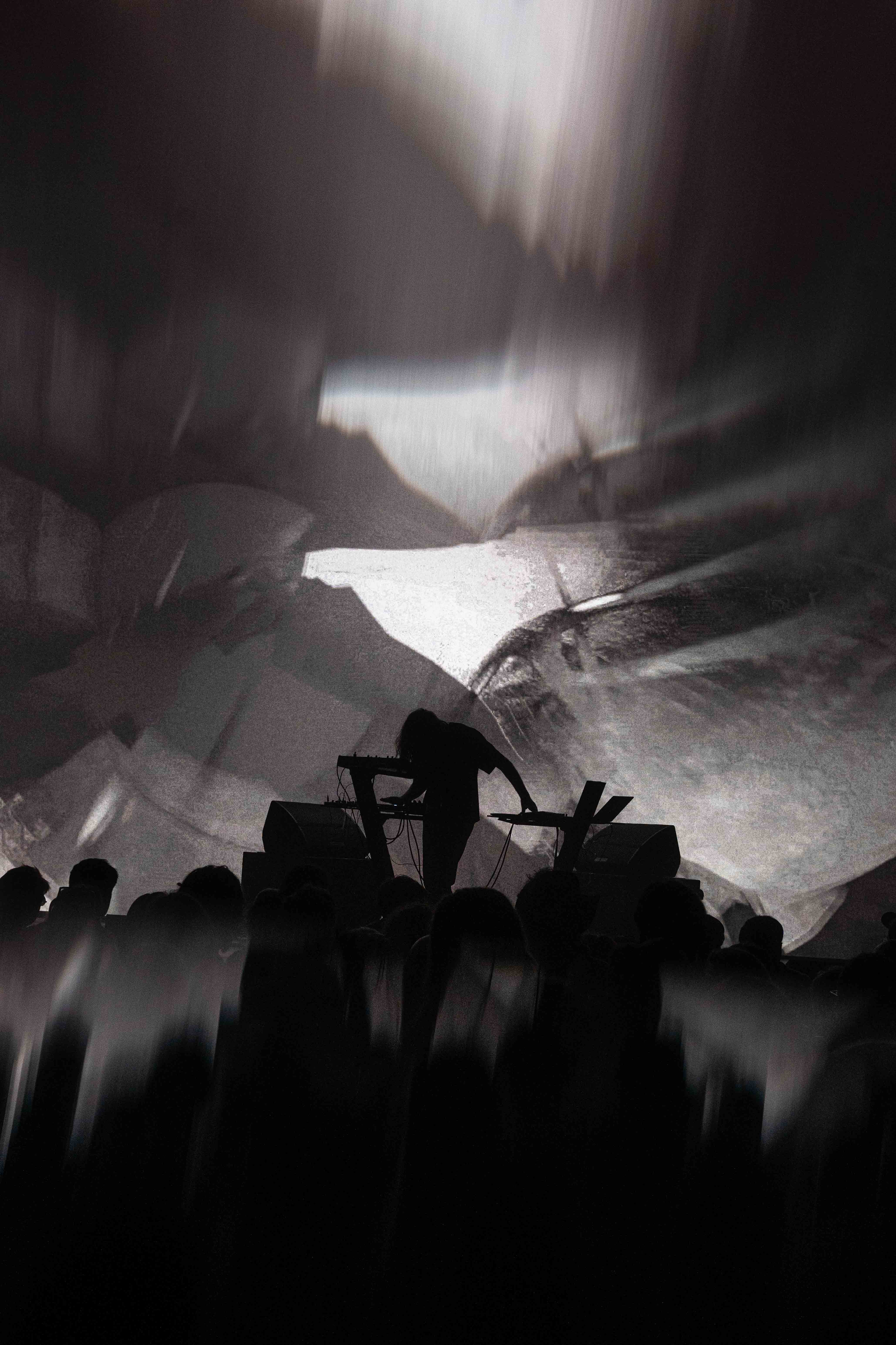 Musicians playing live at a concert, engaging with the audience and delivering an electrifying performance.